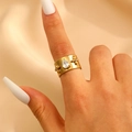 Wide golden stainless steel ring with pear-cut zircon and floral accent on hand - Waterdrop Zircon Four-petal Flower Relief Style (12245)