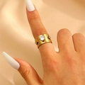 Golden wide-band stainless steel ring with zircon centerpiece and star engravings - Round Zircon Star Embellished Wide Style (5322)