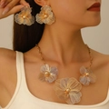 Elegant gold flower jewelry set featuring a hollow-out filigree necklace and earrings - Two Piece (11)