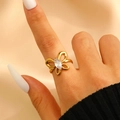 Elegant gold butterfly ring with marquise-cut zircon stone on model's finger - Marquise Zircon Butterfly Hollow Style (7649)