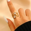 Gold plated stainless steel ring with elegant irregular curved lines and pear cut zircons - Dual Waterdrop Zircon Infinity Style (5354)