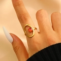 Irregular gold stainless steel ring with oval frame and orange zircon gemstone - Oval Hollow Orange-Red Zircon Style (6462)
