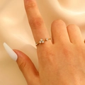Delicate gold textured ring with five sparkling zircons on a model's finger - Five-diamond Staggered Thin Band Gold Style (1986)