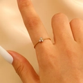 Elegance gold twist band ring featuring three-stone clover zircon on silk background - Three-diamond Flower Cluster Ultra-thin Twisted Style (1985)