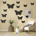Set aus schwarzen 3D-Schmetterling-Wandtattoos in verschiedenen Größen für modernes Wohnzimmer - 12er Set / Schwarz