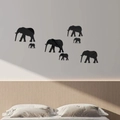 Detail of 7-piece set black acrylic elephant mirror wall stickers in a modern bedroom décor - Black