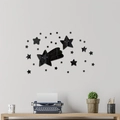 Detail of black acrylic 3D star wall stickers with mirrored finish on a living room wall - Black