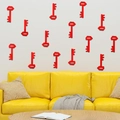 3D acrylic key mirror wall stickers in red for living room decor above yellow sofa - Red