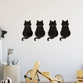 Set of four black cat mirror wall stickers with a glossy acrylic finish for home decor - Black