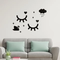 Close-up of minimalist black acrylic 3D wall stickers featuring eyelashes and stars - Black