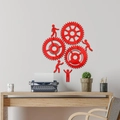 Detail of red mirror acrylic wall sticker featuring 3D gears and human figures in an office - Red