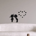 Detailed view of black acrylic mirror wall stickers featuring boy and girl silhouettes - Black