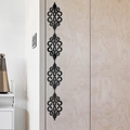Vertical black acrylic wall stickers with baroque floral pattern on light wood furniture - Black Glossy Scroll Style (JM3210)