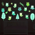 Glow-in-the-dark owl wall stickers with luminous trees and butterflies for nursery decor - Green