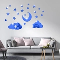 Blue mirrored 3D star moon and cloud wall stickers applied above a living room sofa - Blue