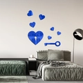 Detailed close-up of blue mirror acrylic heart and key stickers on a bedroom wall - Blue (JM3153)