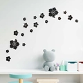 Detailed close-up of 3D black acrylic floral wall stickers with a reflective mirror finish - Black