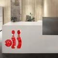 Detail of red acrylic bowling mirror wall stickers on a modern office front desk - Red