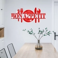 Macro detail of red acrylic Bon Appetit wall sticker with mirror finish and cutlery design - Red