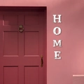 Adesivi murali HOME in acrilico a specchio con effetto riflettente su muro rosa - Argento