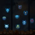 Luminous Halloween monster wall stickers glowing blue in dark window scene with pumpkins - Blue