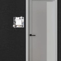 Detail of mirror acrylic light switch cover with black scrollwork on a modern wall - Silver