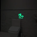 Luminous green toilet wall sticker with cartoon figure and TOILET text for bathroom - Green