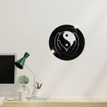 Macro shot of circular Tai Chi Yin Yang mirror wall sticker in a modern office setup - Black