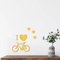 Dettaglio di adesivi murali a specchio in acrilico giallo con bici e cuore - Oro
