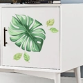 Monstera-Blatt-Wandaufkleber für moderne Wohndeko auf einem weißen Minimalschrank - Monstera Blatt (PH-QT601)