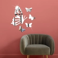 Détails de stickers muraux miroirs papillons en acrylique sur un mur d'accent rouge - Argenté