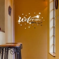 Dettaglio dell'adesivo da parete specchiato Welcome in acrilico con stelle decorative - Argento
