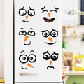 Close-up of 6 snowman facial expression stickers applied to a white refrigerator surface - Snowman Facial Expression (PH_QTX42)