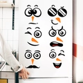Close-up of cute cartoon snowman face stickers applied on a white refrigerator door - Fun Expression Combination (PH_QTX43)