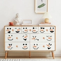Cute PVC snowman face stickers with carrot nose design applied to white furniture drawers - Cartoon Expression Series (PH_QTX41)