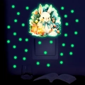 Luminous wall stickers showing a glowing green rabbit and stars in a dark bedroom - Yg_b075 Green Light