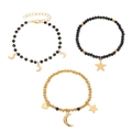 Three-piece black beaded bracelet set featuring gold star and moon charms with elastic bands - Star and Moon Theme Black Gold Set (7726)