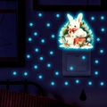 Luminous wall sticker featuring a white rabbit with festive berries and glowing blue stars - Rabbit with Bow - Blue Luminous (YG_B076 Blue)