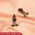 Close-up of wizard hat and striped legs earrings on pink satin showing size 3x1.5cm - Witch Legs Design