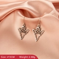 Close-up of silver ghost earrings with BOO lettering and sparkling crystal eyes - BOO Ghost Style