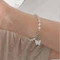 Elegant white pearl bracelet featuring a cream butterfly pendant and silver OT toggle clasp - Artificial Pearl Beaded (01 White x447) / White Butterfly