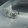 Elegant hollow butterfly open ring in silver finish with detailed spherical accents - Hollow Butterfly Ring (WG0-1074)