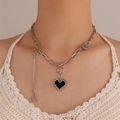 Silver tone layered heart necklace with Good Luck tag and crystal fringe on a model - White K Layered Heart Good Luck Pendant Style (1762)