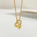 Elegant gold heart pendant necklace featuring a mother and child design with cubic zirconia - Gold Double Heart