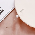 Minimalist silver twist wire ear cuff with glossy white pearl in elegant fashion style - Pearl Silver