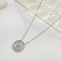 Silver heart necklace with zircon pendant showing mother and child embracing - Silver Beaded Circle