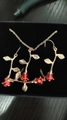 Elegant gold necklace and earring set featuring red enamel rosebuds in a black jewelry box - Rose Necklace And Earrings Set (KC Gold) / KC Gold