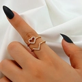 Close-up of gold plated heart and V-shaped chevron stacking rings with zircon on finger - Hollow Heart Style (G-404) / Two-Piece Set / KC Gold