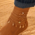 Detail of 6-piece bohemian gold anklet set with pearls and leaf charms on beach - Gold Hollow Leaf Pearl (7722)