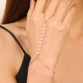 Detail view of the elegant slave bracelet with gold chain and white imitation pearls - Gold Style (2297)